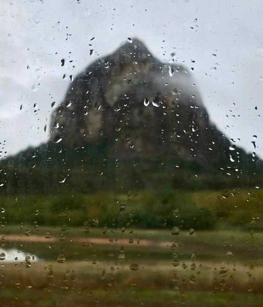 mountain through rainy window pane